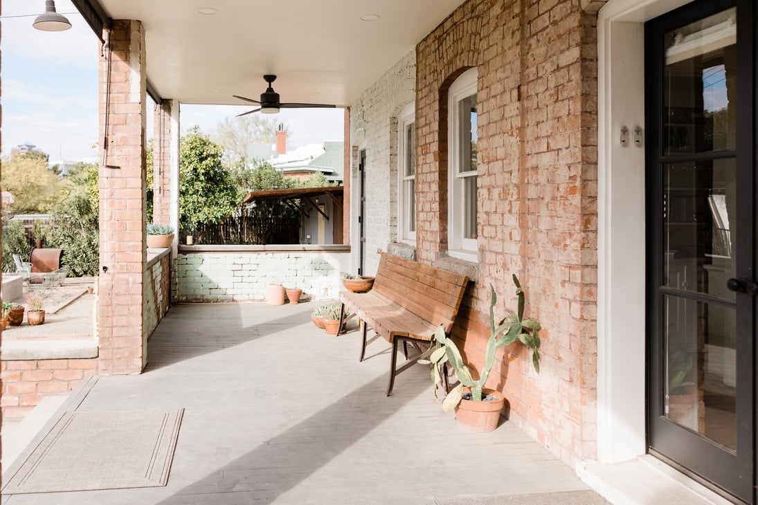 Bench and Plants by the Door of a House